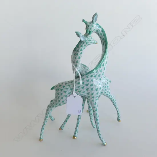 A Herend Porcelain giraffe group, in green 'fishnet' pattern